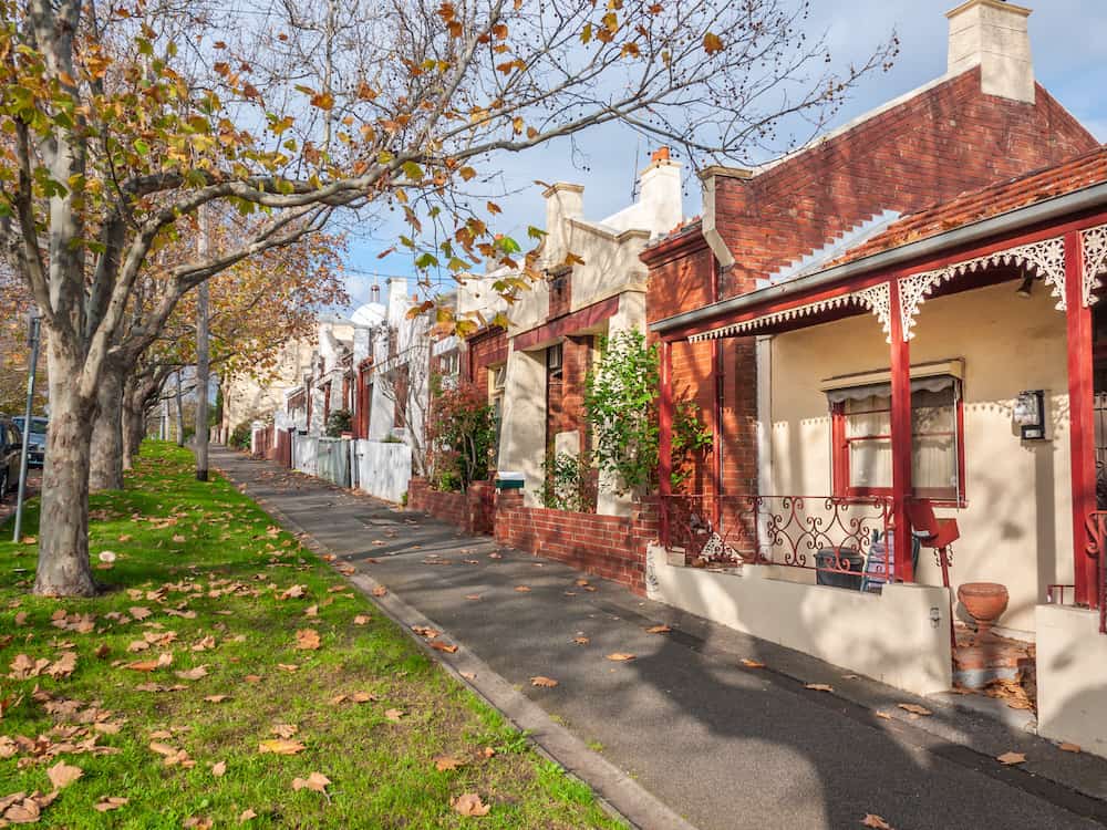 pedestrian sidewalk and victorian style houses in a quiet neighbourhood street view of a melbourne old residential suburb north melbourne vic australia
